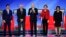 From left, Democratic presidential candidates Pete Buttigieg, Sen. Bernie Sanders, Joe Biden, Elizabeth Warren, and Amy Klobuchar, are seen ahead of their primary debate at Saint Anselm College in Manchester, New Hampshire, Feb. 7, 2020. 