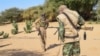 FILE - Fighters from Permanent Strategic Framework for the Defense of the People of Azawad patrol in Tinzaouaten, northern Mali, Nov. 27, 2024.