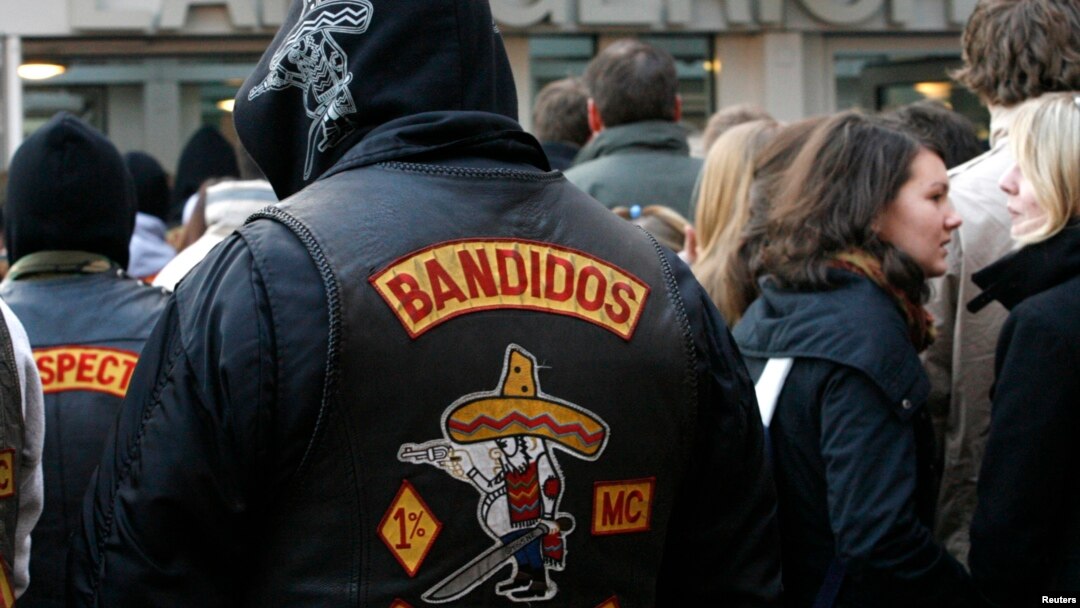 FILE - Members of motorcycle gang 'Bandidos' wait in front the regional court in Muenster.