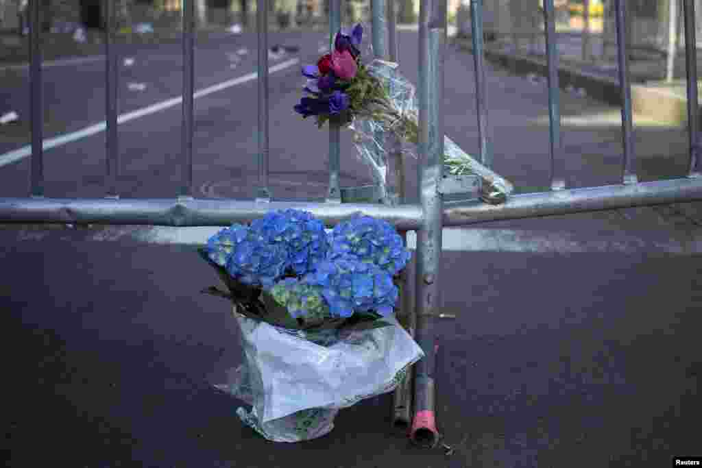 Flowers are seen at the barricaded entrance at Boylston Street near the finish line of the Boston Marathon in Boston, Massachusetts.