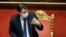 FILE - Italian Prime Minister Giuseppe Conte speaks ahead of a confidence vote at the upper house of parliament, in Rome, Jan. 19, 2021.