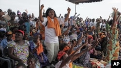 Opposition supporters react to an announcement that the parliamentary elections set for July 21 will be pushed back, during an opposition rally to protest the start of campaigning, in Lome, Togo, July 6, 2013. 