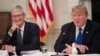 FILE - U.S. President Donald Trump speaks alongside Apple CEO Tim Cook in the State Dining Room of the White House in Washington, March 6, 2019. 