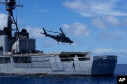 FILE - A Philippine navy helicopter takes off after a military exercise on Nov. 6, 2024, off Loaita island, locally called Kota island, in the disputed South China Sea, Philippines.