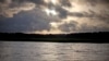 FILE - The sun rises over Sapelo Island, Georgia, a Gullah-Geechee community, June 10, 2013.