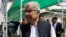 FILE - Pakistan's Defense Minister Khawaja Muhammad Asif leaves the Parliament after attending a joint session to discuss the crisis in Yemen, in Islamabad, Pakistan, April 10, 2015.