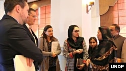 Afghan refugee teacher, Aqeela Asifi, shares her perspective on the Refugee Affected and Hosting Areas Initiative with U.S. Ambassador to Pakistan Richard G. Olson and UNDP Country Director, Marc-André Franche, Aug. 28, 2015. (UNDP Pakistan/Tabinda Siddiqi)