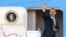 FILE - President Barack Obama waves as he boards Air Force One at Andrews Air Force Base in Maryland en route to Southeast Asia, November 17, 2012.