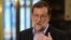 Spanish interim Prime Minister Mariano Rajoy holds a press conference after his meeting with the leader of center-right party Ciudadanos at the Congress (Las Cortes) in Madrid on Aug. 18, 2016.