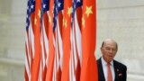 FILE - U.S. Commerce Secretary Wilbur Ross arrives at a state dinner at the Great Hall of the People in Beijing, China, Nov. 9, 2017.