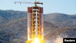 FILE - A North Korean long-range rocket is launched into the air at the Sohae rocket launch site, North Korea, in this photo released by Kyodo Feb. 7, 2016.