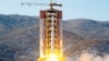 FILE - A North Korean long-range rocket is launched into the air at the Sohae rocket launch site, North Korea, in this photo released by Kyodo Feb. 7, 2016.