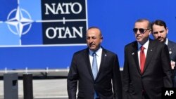 Perezida wa Turukiya Recep Tayyip Erdogan (hagati)