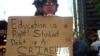 FILE - A college student voices his opinion on education and student debt during the Occupy Wall Street movement in New York City, Oct. 9, 2011. (Photo by Phineas Azcuy)