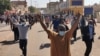 FILE - Sudanese protesters rallying against the military take to the streets of Khartoum, Jan. 6, 2022. 