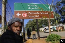 A man waits outside Zithulele Hospital for an appointment with physiotherapist Laura Grobicki