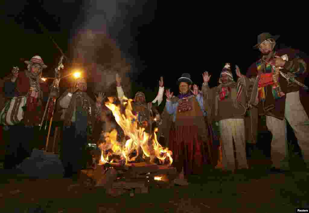 Aymara witch doctors give thanks for the arrival of Bolivia's President Evo Morales outside of El Alto airport on the outskirts of La Paz, July 3, 2013.