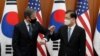 US Secretary of State Antony Blinken (L) bumps elbows with South Korean Foreign Minister Chung Eui-yong after an initialing ceremony for Special Measures Agreement at the Foreign Ministry in Seoul on March 18, 2021. (Photo by Lee Jin-man / POOL /…