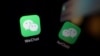 FILE - The sign of the WeChat app is seen reflected on a mobile phone in this illustration picture taken Sep. 19, 2020. 