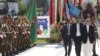 In this photo released by the Afghan Presidential Palace, Afghan President Ashraf Ghani, right, inspects the guard of honor during Independence Day celebrations at Defense Ministry in Kabul, Afghanistan, Monday, Aug. 19, 2019. Afghanistan's president is v