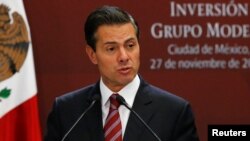 FILE - Mexican President Enrique Pena Nieto gives a speech at Los Pinos presidential residence in Mexico City, Nov. 27, 2017. 