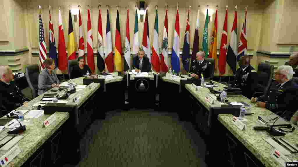 U.S. President Barack Obama speaks at a meeting with more than 20 foreign defense chiefs to discuss the coalition efforts in the ongoing campaign against Islamic State militants at Joint Base Andrews in Washington, Oct. 14, 2014. 