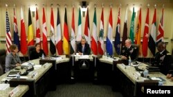 U.S. President Barack Obama speaks at a meeting with more than 20 foreign defense chiefs to discuss the campaign against Islamic State militants at Joint Base Andrews in Washington, Oct. 14, 2014. (REUTERS/Kevin Lamarque)