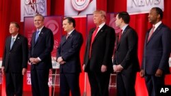 Republican presidential candidates take the stage before the CBS News Republican presidential debate at the Peace Center, Feb. 13, 2016, in Greenville, S.C.