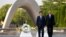 U.S. President Barack Obama (R) and Japanese Prime Minister Shinzo Abe walk in front of a cenotaph after they laid wreaths at Hiroshima Peace Memorial Park in Hiroshima, Japan, May 27, 2016.