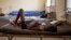 FILE- A child suffering from the Ebola virus receives treatment at Makeni Arab Holding Center in Makeni, Sierra Leone, Oct. 4, 2014.