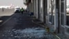 Workers walk past broken glass in Sanaa International Airport following Thursday's Israeli airstrikes on Yemen, Dec. 27, 2024. 