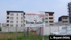 A sign advertises new apartment sales in Grigny, an area of with some of the highest rates of unemployment, school drop outs and illiteracy in France.