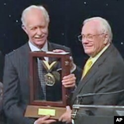 Former Astronaut Neil Armstrong presented Chesley Sullenberger with the Neil Armstrong Medal of Excellence