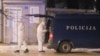 Police investigators work at the site of a shooting in Cetinje, Montenegro, Jan. 1, 2025. At least 10 people, including two children, were killed in the shooting that followed a bar brawl. 