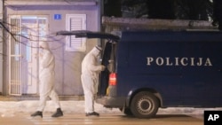 Police investigators work at the site of a shooting in Cetinje, Montenegro, Jan. 1, 2025. At least 10 people, including two children, were killed in the shooting that followed a bar brawl. 