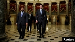 FILE - Speaker of the House Paul Ryan (R-WI), right, walks to the House floor before a vote, on Capitol Hill in Washington, Feb. 9, 2018.