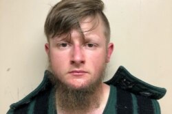 Robert Aaron Long, 21, of Woodstock in Cherokee County poses in a jail booking photograph after he was taken into custody by the Crisp County Sheriff's Office in Cordele, Georgia, March 16, 2021.