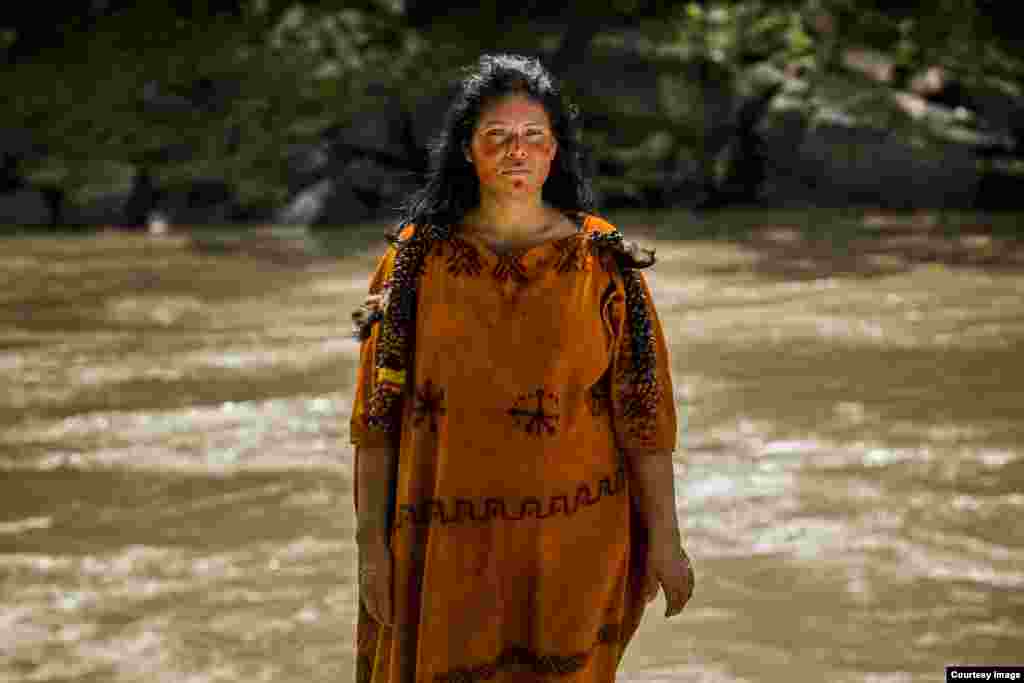 Ruth Buendia fled her native land as a child during Peru’s civil war. Reconnecting with her people through environmental issues, she’s shown here on the banks of the Ene River. (Goldman Environmental Prize)