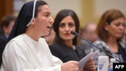 Sister Diana Momeka, a Roman Catholic nun driven out of a convent in Mosul, Iraq, testifies before the House Foreign Affairs Committee during a hearing on IS persecution of religious minorities, on Capitol Hill May 13, 2015.