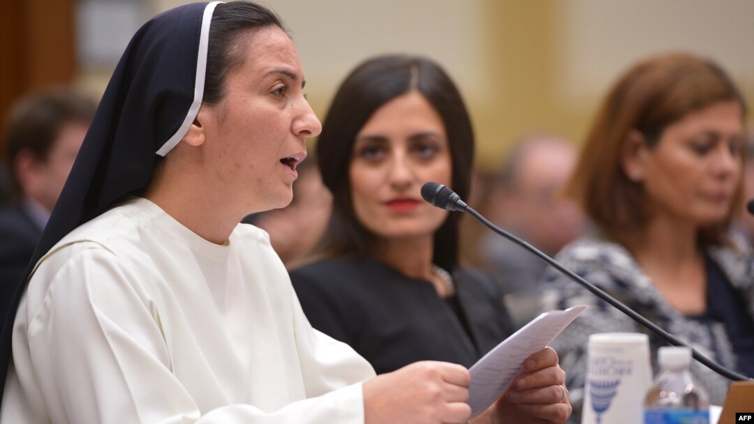 Sister Diana Momeka, a Roman Catholic nun driven out of a convent in Mosul, Iraq, testifies before the House Foreign Affairs Committee during a hearing on IS persecution of religious minorities, on Capitol Hill May 13, 2015.