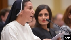 Sister Diana Momeka, a Roman Catholic nun driven out of a convent in Mosul, Iraq, testifies before the House Foreign Affairs Committee during a hearing on IS persecution of religious minorities, on Capitol Hill May 13, 2015.