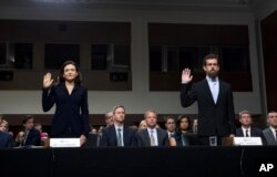 Facebook COO Sheryl Sandberg, left, accompanied by Twitter CEO Jack Dorsey are sworn in before the Senate Intelligence Committee hearing on 'Foreign Influence Operations and Their Use of Social Media Platforms' on Capitol Hill, Sept. 5, 2018, in Washington.