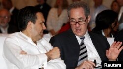 FILE - U.S. Trade Representative Michael Froman (R) attends a plenary session of the WTO Ministerial Conference in Nusa Dua, Bali, Dec. 4, 2013. 