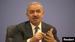 Palestinian Prime Minister Mohammad Shtayyeh addresses journalists during a meeting with members of the Foreign Press Association in Ramallah, in the Israeli-occupied West Bank, June 9, 2020.