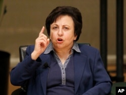 FILE - Shirin Ebadi participates in the World Summit of Nobel Peace Laureates, April 25, 2012, in Chicago. On Wednesday, Ebadi urged Iranians to press on with their nationwide protests.