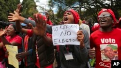 FILE - Opposition supporters march on the streets of Harare, Zimbabwe, June, 5, 2018.