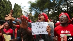 FILE - Opposition supporters march on the streets of Harare, Zimbabwe, June, 5, 2018.