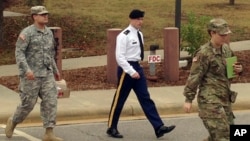 Army Sgt. Bowe Bergdahl, center, leaves a courtroom after a pretrial hearing in Fort Bragg, North Carolina, Nov. 14, 2016. Bergdahl faces a military trial in 2017 on charges of desertion and misbehavior before the enemy after walking off his post in Afghanistan in 2009.