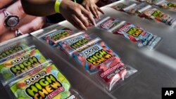 FILE - In this Saturday, Oct. 20, 2018 photo medicated High Chew edibles are shown on display and offered for sale at the cannabis-themed Kushstock Festival at Adelanto, Calif. (AP Photo/Richard Vogel)