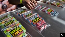 FILE - In this Saturday, Oct. 20, 2018 photo medicated High Chew edibles are shown on display and offered for sale at the cannabis-themed Kushstock Festival at Adelanto, Calif. (AP Photo/Richard Vogel)